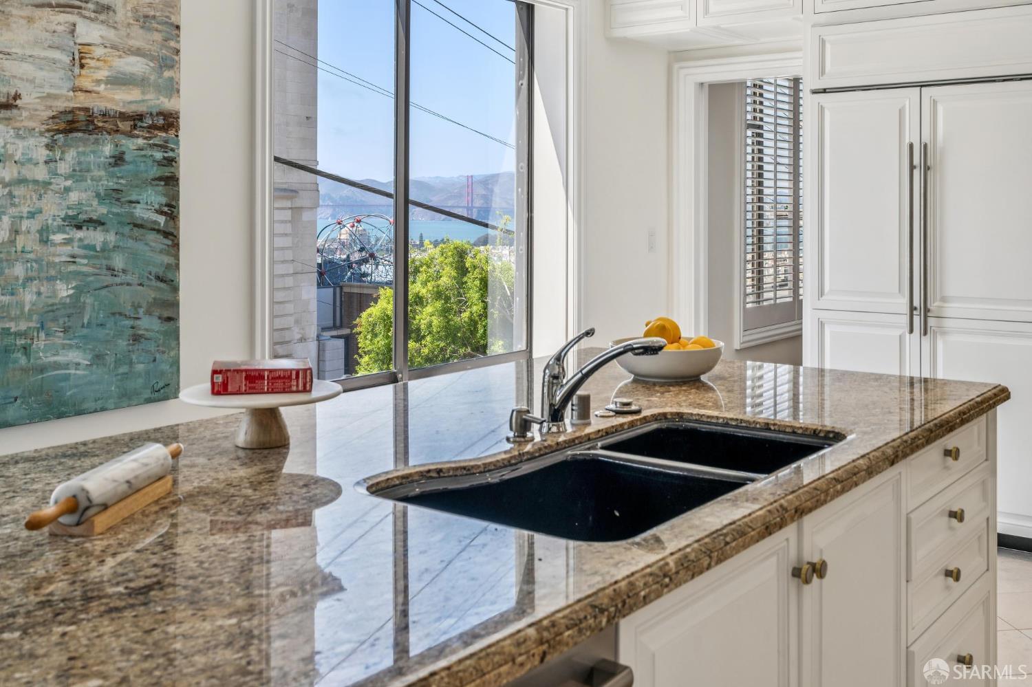 2190 Broadway, Unit 1W San Francisco, CA 94115 - Photo 25 of 66 a kitchen with a sink a counter top space and a window