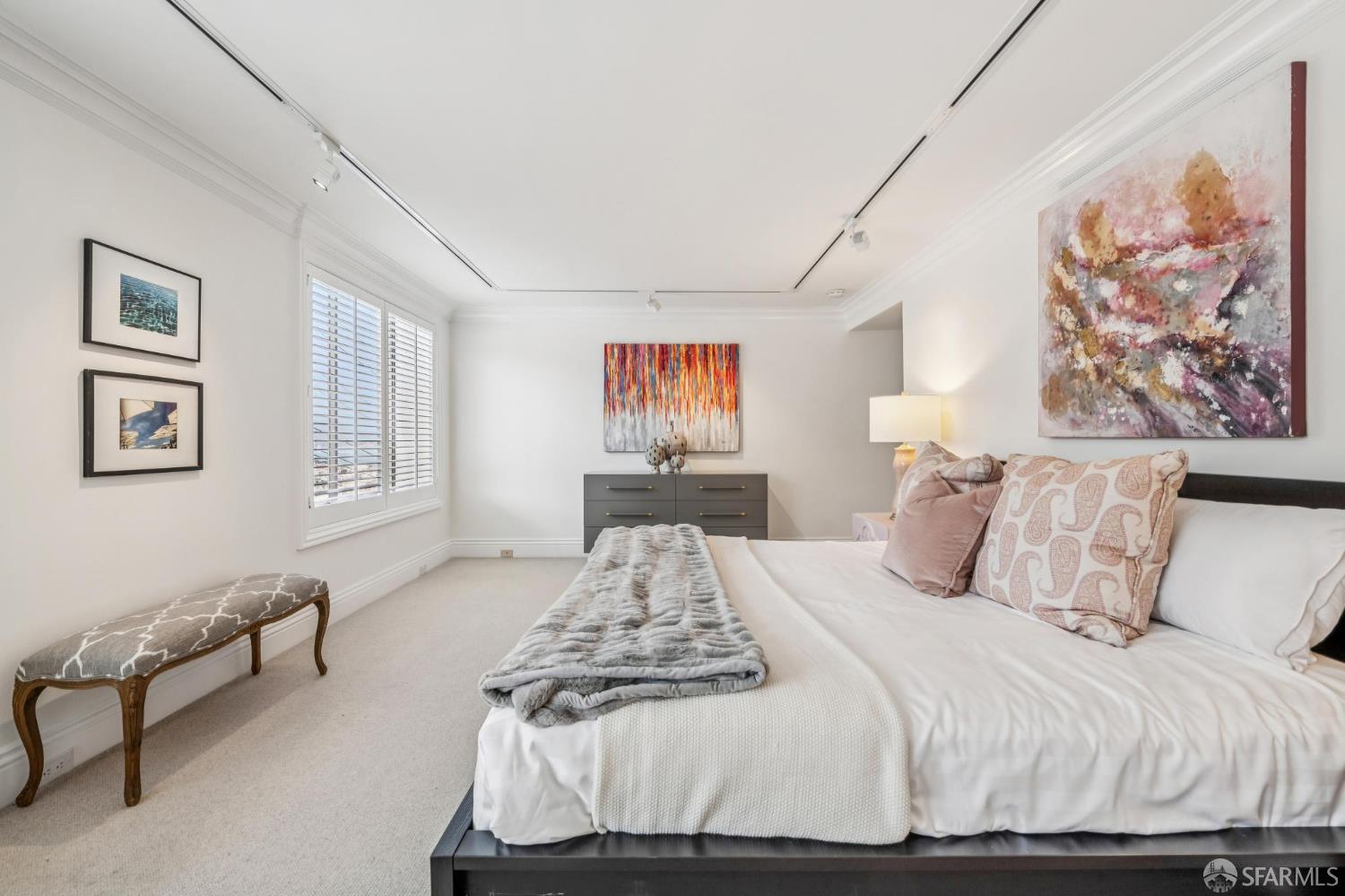 2190 Broadway, Unit 1W San Francisco, CA 94115 - Photo 60 of 66 a bedroom with a large bed and a couch