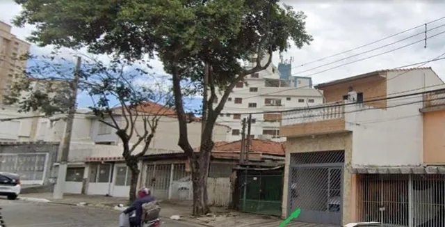 a bedroom with a bed and a mirror