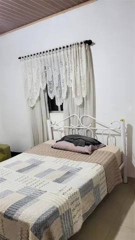 a view of a chair and table in the patio with a yard