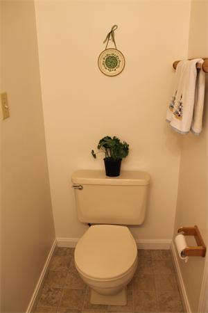 133 Patrick Road, Unit 133 Tewksbury, MA 01876 - Photo 14 of 30 a bathroom with a toilet and a mirror