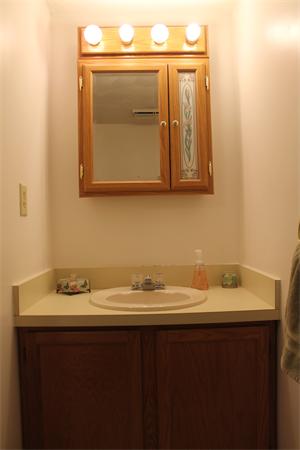 133 Patrick Road, Unit 133 Tewksbury, MA 01876 - Photo 15 of 30 a bathroom with a sink and a mirror