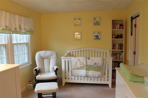 133 Patrick Road, Unit 133 Tewksbury, MA 01876 - Photo 17 of 30 a bedroom with furniture and a window