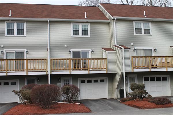 133 Patrick Road, Unit 133 Tewksbury, MA 01876 - Photo 2 of 30 a front view of a house with balcony