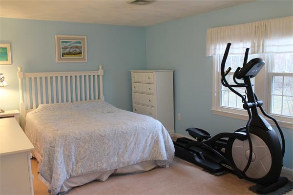 133 Patrick Road, Unit 133 Tewksbury, MA 01876 - Photo 23 of 30 a bedroom with a bed and window
