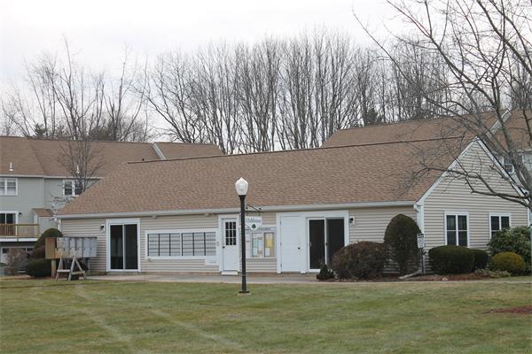 133 Patrick Road, Unit 133 Tewksbury, MA 01876 - Photo 30 of 30 a front view of a house with a yard