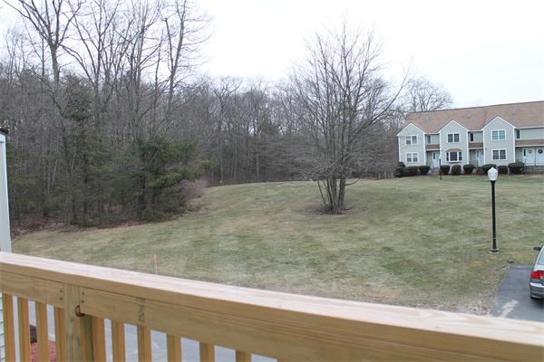133 Patrick Road, Unit 133 Tewksbury, MA 01876 - Photo 7 of 30 a view of yard in front of house