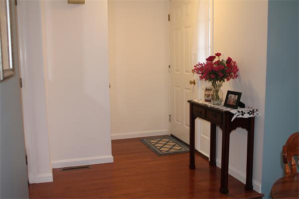 133 Patrick Road, Unit 133 Tewksbury, MA 01876 - Photo 9 of 30 a view of entryway with wooden floor