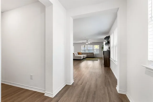 a view of a living room with hardwood floor