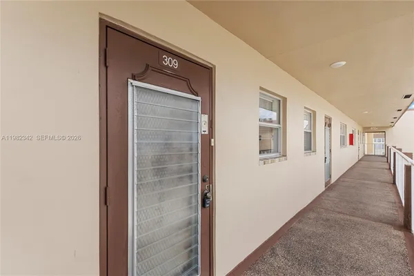 a view of a hallway with windows