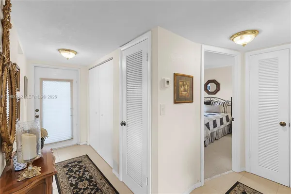 a view of a hallway with bathroom