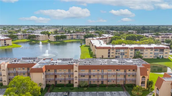 a view of a lake with building in front of it