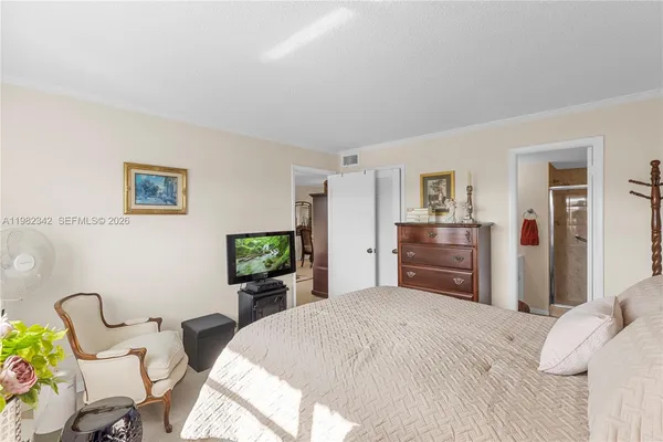 a bedroom with a bed and furniture