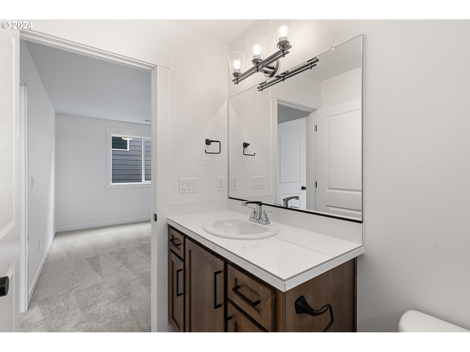 926 Northwest 178th Street Ridgefield, WA 98642 - Photo 41 of 48 a bathroom with a sink and a mirror