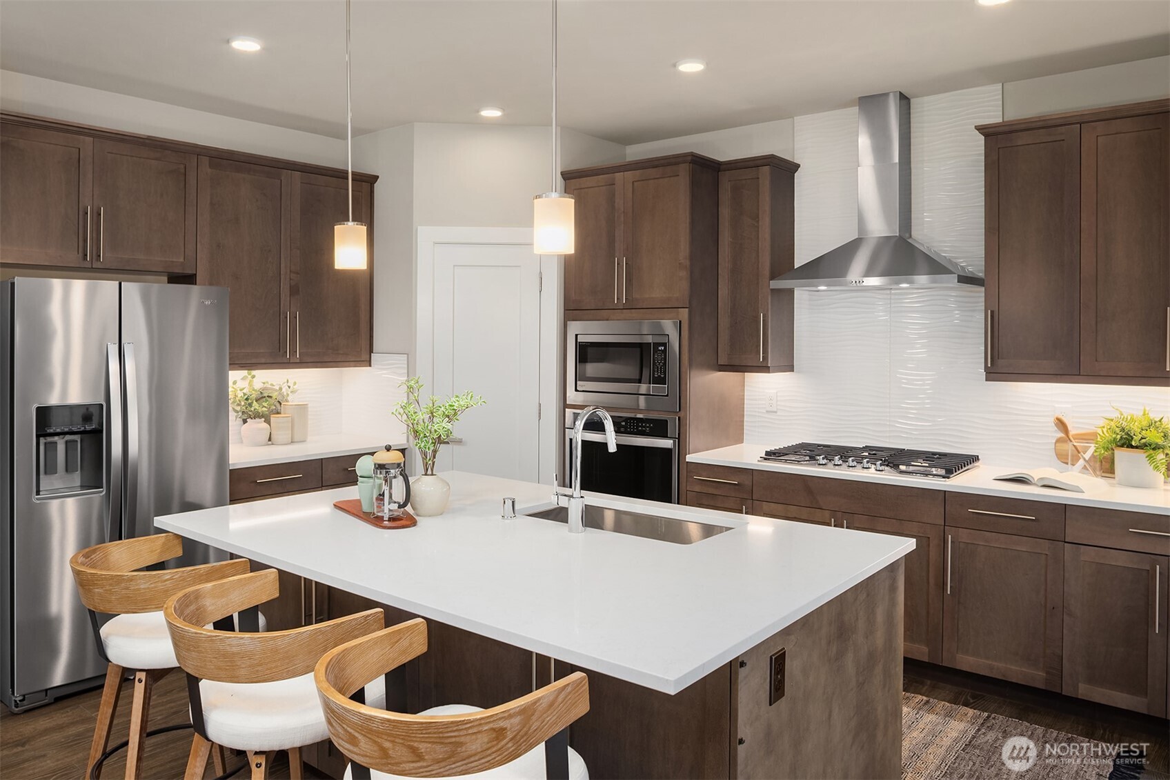 2015 228th Place Southwest Bothell, WA 98021 - Photo 14 of 40 a kitchen with stainless steel appliances a sink a stove a refrigerator and cabinets