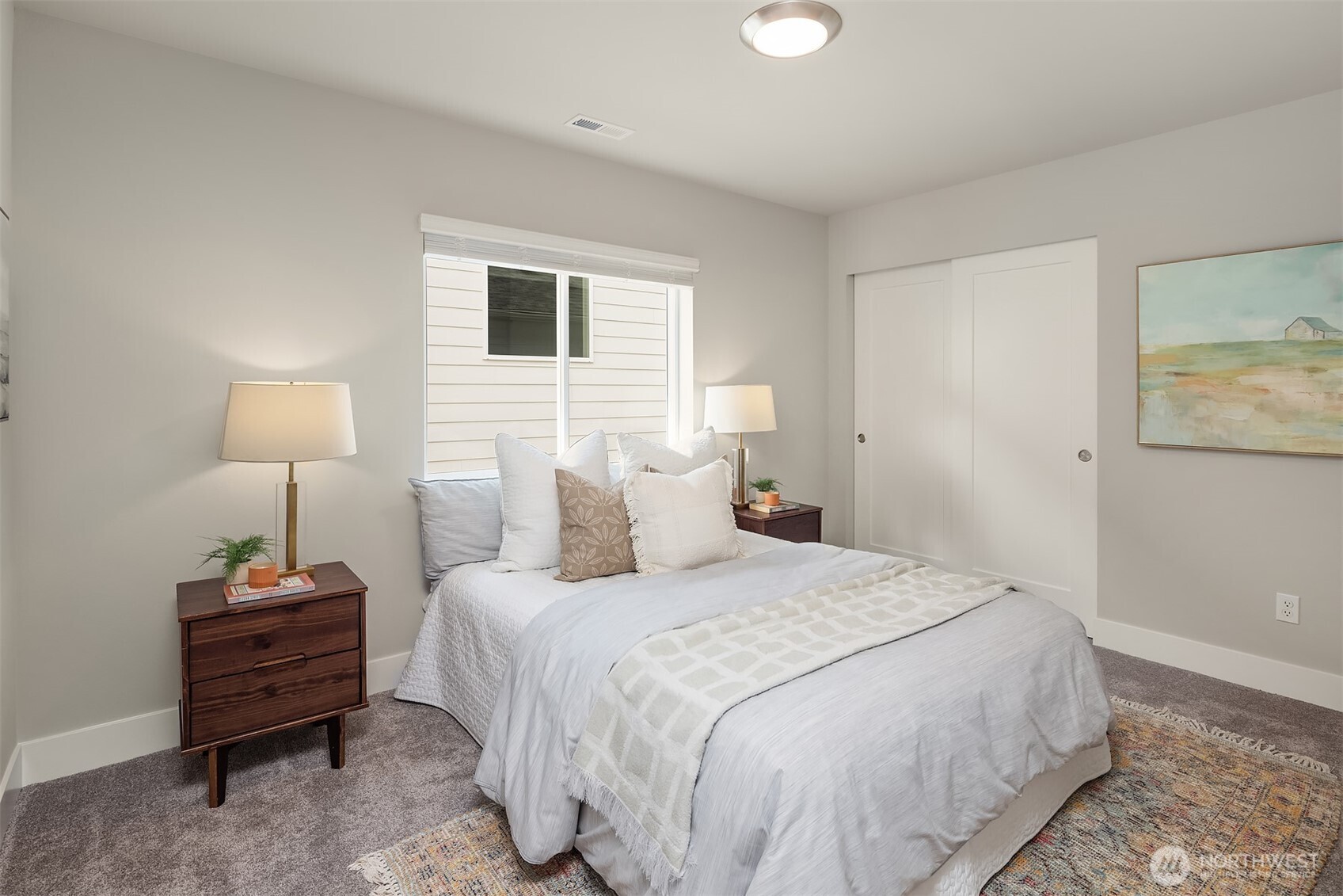 2015 228th Place Southwest Bothell, WA 98021 - Photo 27 of 40 a bedroom with a bed lamp and a closet