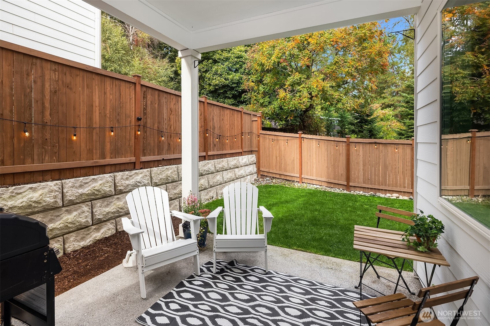 2015 228th Place Southwest Bothell, WA 98021 - Photo 31 of 40 a view of a chair and tables in the backyard