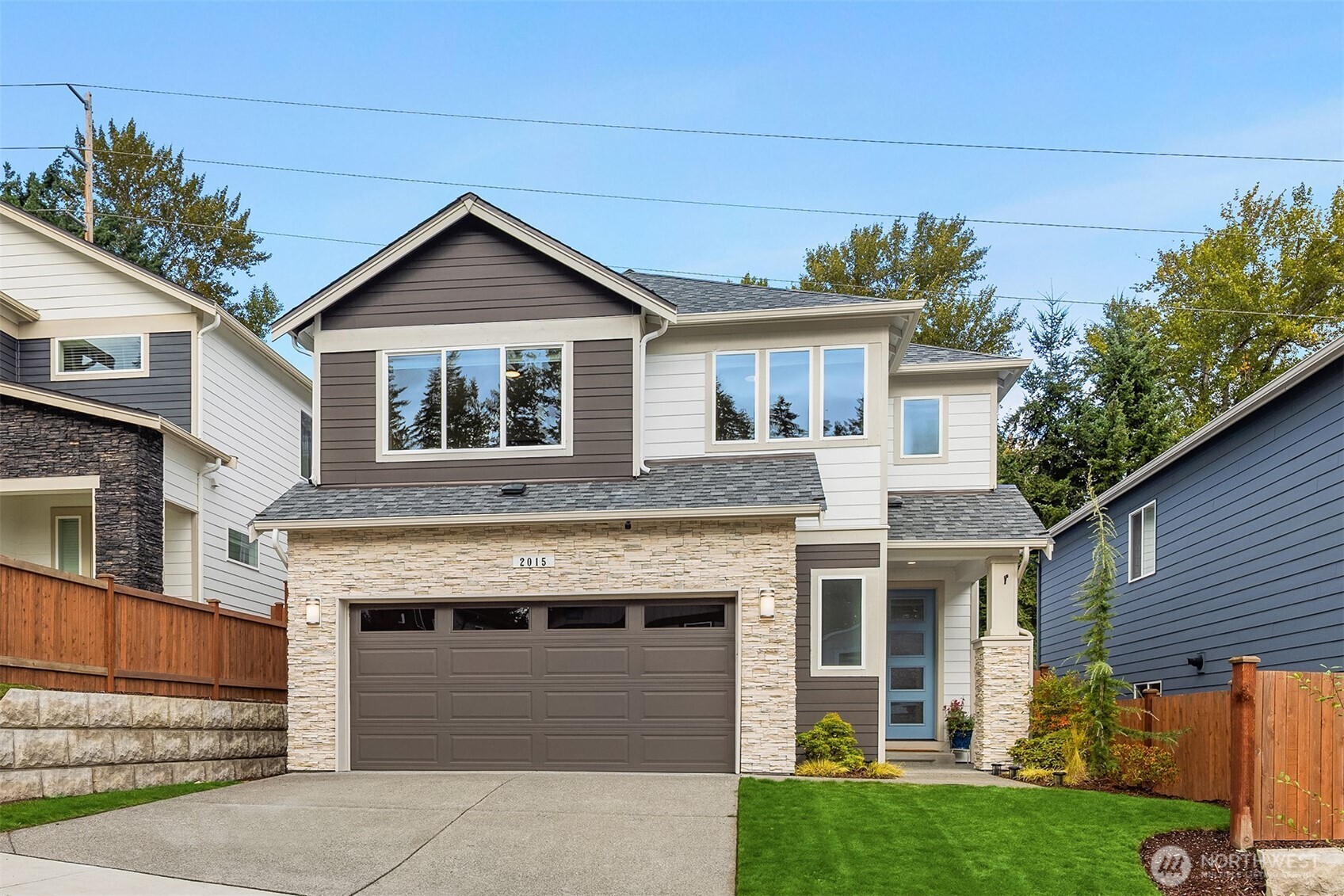 2015 228th Place Southwest Bothell, WA 98021 - Photo 35 of 40 a front view of a house with a yard and garage