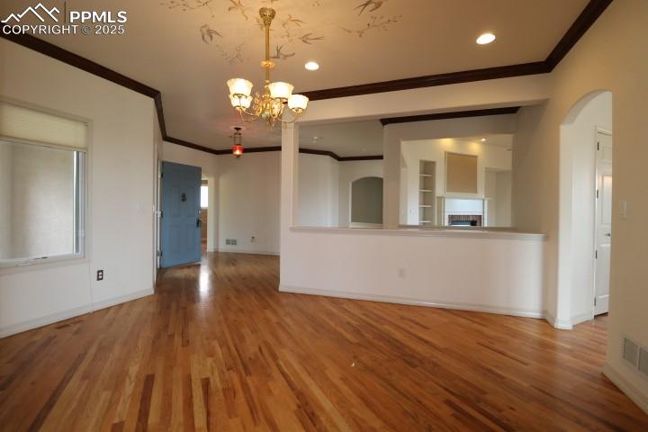 4015 Ramshorn Point Colorado Springs, CO 80904 - Photo 14 of 44 a view of a room with wooden floor and a ceiling fan