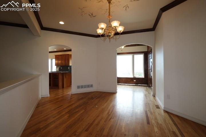 4015 Ramshorn Point Colorado Springs, CO 80904 - Photo 15 of 44 wooden floor in an empty room with a window