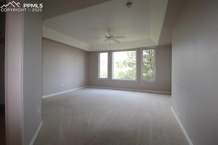 4015 Ramshorn Point Colorado Springs, CO 80904 - Photo 16 of 44 an empty room with windows and ceiling fan