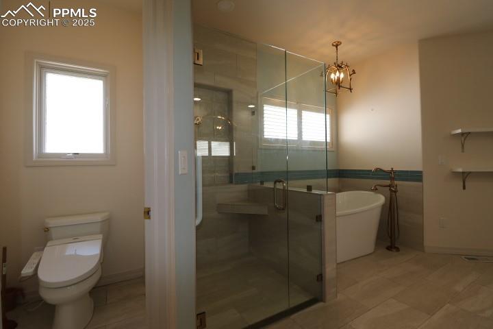 4015 Ramshorn Point Colorado Springs, CO 80904 - Photo 19 of 44 a bathroom with a toilet sink and mirror