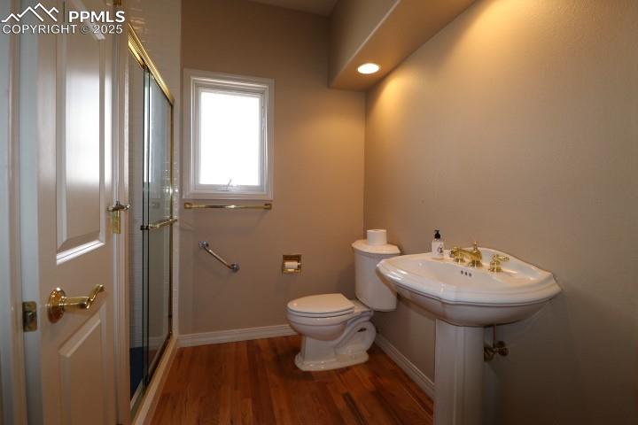 4015 Ramshorn Point Colorado Springs, CO 80904 - Photo 23 of 44 a bathroom with a sink toilet and a mirror