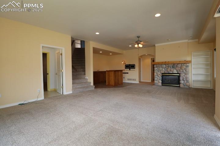4015 Ramshorn Point Colorado Springs, CO 80904 - Photo 25 of 44 an empty room with furniture and a fireplace