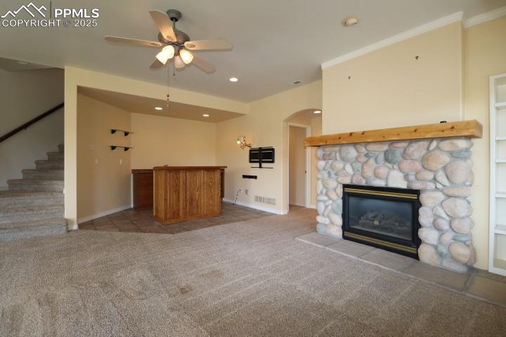 4015 Ramshorn Point Colorado Springs, CO 80904 - Photo 28 of 44 an empty room with a fireplace and fan