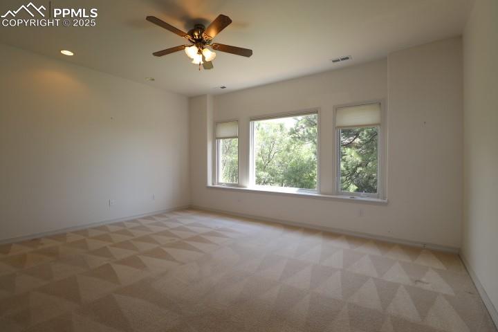 4015 Ramshorn Point Colorado Springs, CO 80904 - Photo 29 of 44 an empty room with a window and a fan