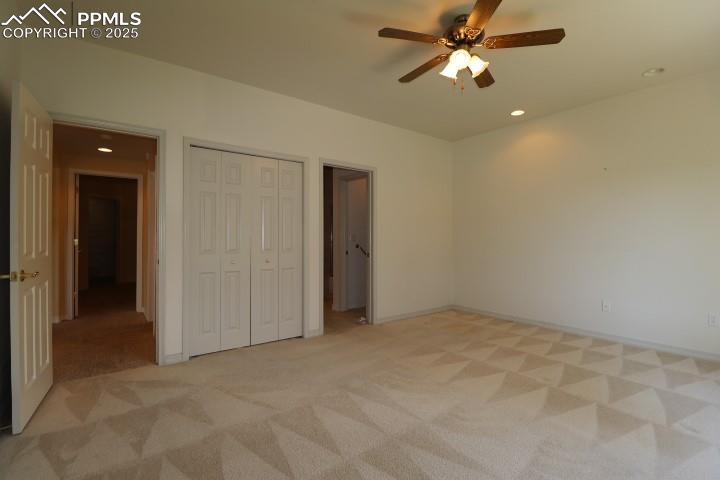 4015 Ramshorn Point Colorado Springs, CO 80904 - Photo 30 of 44 an empty room with closet and a chandelier fan
