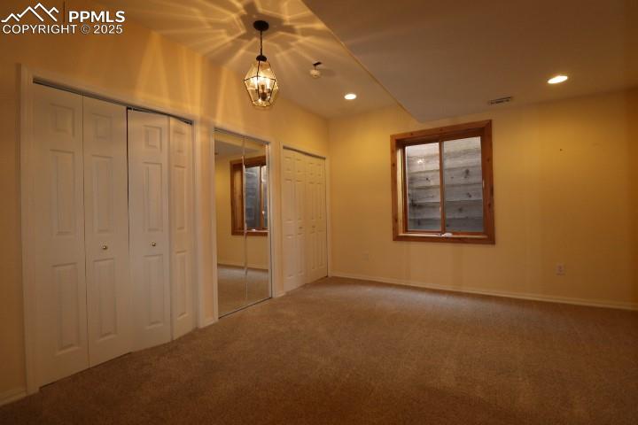 4015 Ramshorn Point Colorado Springs, CO 80904 - Photo 32 of 44 an empty room with windows and fan