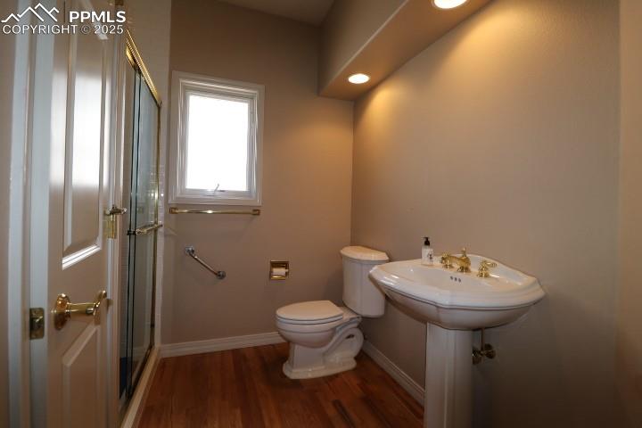 4015 Ramshorn Point Colorado Springs, CO 80904 - Photo 37 of 44 a bathroom with a sink toilet and shower