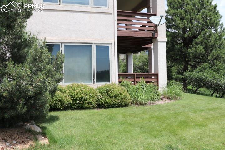 4015 Ramshorn Point Colorado Springs, CO 80904 - Photo 38 of 44 a view of a house with potted plants and a yard