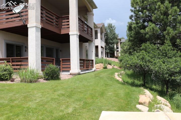 4015 Ramshorn Point Colorado Springs, CO 80904 - Photo 40 of 44 a front view of a house with garden