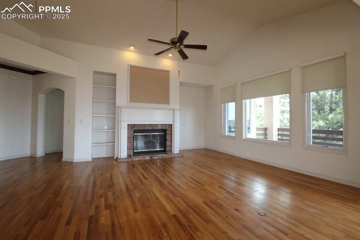 4015 Ramshorn Point Colorado Springs, CO 80904 - Photo 9 of 44 a view of empty room with wooden floor and fireplace