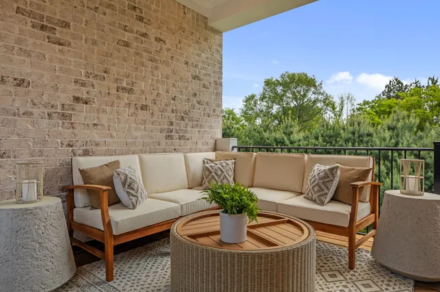 a bedroom with bed and a chandelier