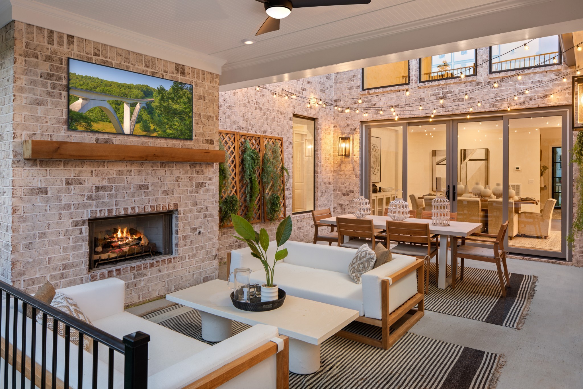 5805 Brees Place Arrington, TN 37014 - Photo 79 of 83 a living room with furniture a fireplace and a large window