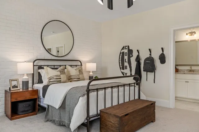 a room with a large window and furniture