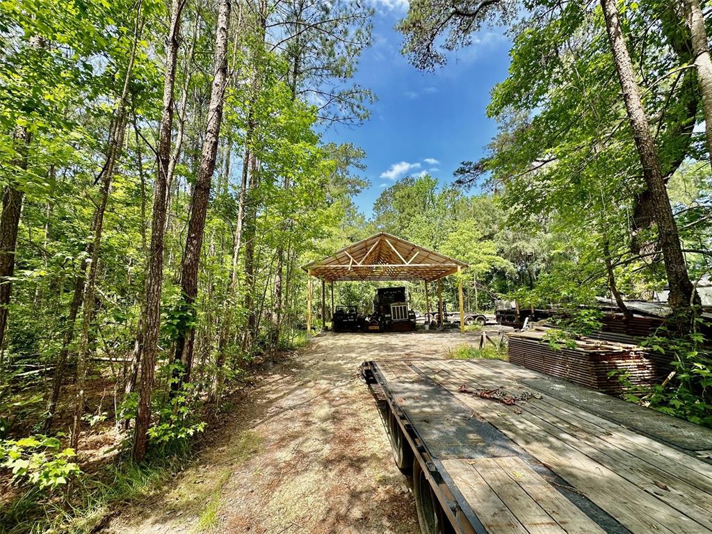 12100 Northwest US Highway 441 Alachua, FL 32615 - Photo 20 of 34 a view of a house with a yard