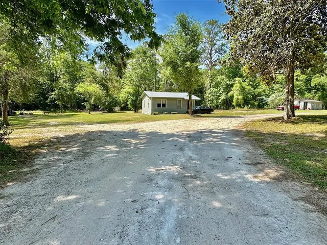 a view of a city with lush green forest