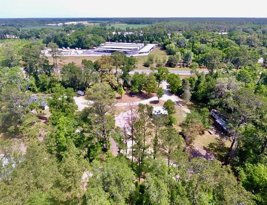 12100 Northwest US Highway 441 Alachua, FL 32615 - Photo 8 of 34 a view of a city with lush green forest