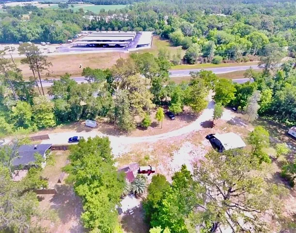 an aerial view of house with yard