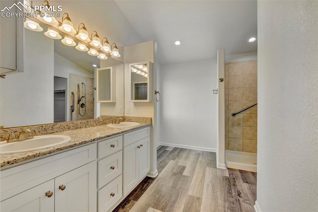 7841 Fort Smith Road Peyton, CO 80831 - Photo 12 of 37 More lovely granite in the Primary bath featuring a double sink vanity.