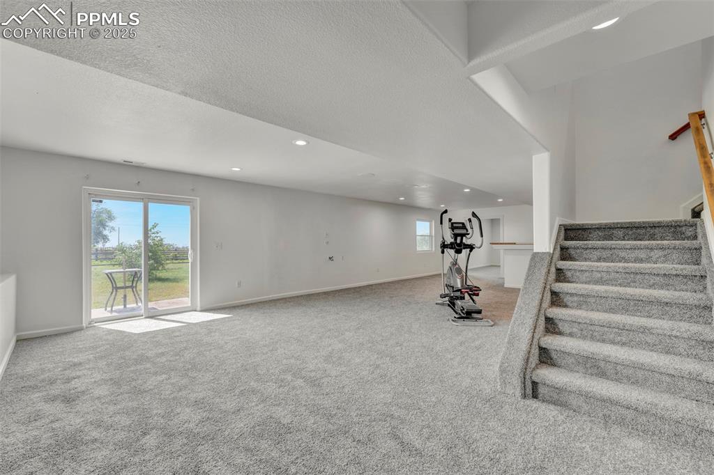 7841 Fort Smith Road Peyton, CO 80831 - Photo 18 of 37 Let's meander to the huge basement with a walkout to the back yard. Room for you avid excersise fans!