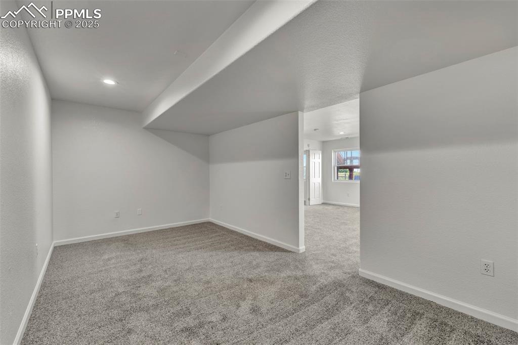 7841 Fort Smith Road Peyton, CO 80831 - Photo 23 of 37 Separate bonus room in basement for crafting, private office space, sewing projects, kids play space or whatsoever your heart desires.