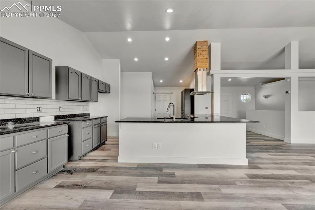 7841 Fort Smith Road Peyton, CO 80831 - Photo 5 of 37 Upon entering this home you will notice the great open concept and lovely luxury vinyl plank flooring. This floor plan is perfect for entertaining a crowd.