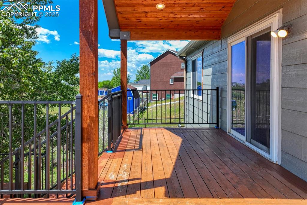 7841 Fort Smith Road Peyton, CO 80831 - Photo 9 of 37 Yes, now step onto the deck and enjoy warm weather dining or extra entertaining space.