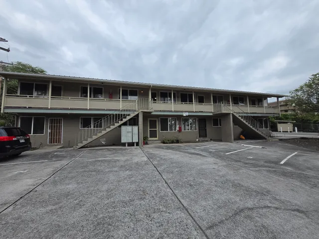 a bedroom with bed and window