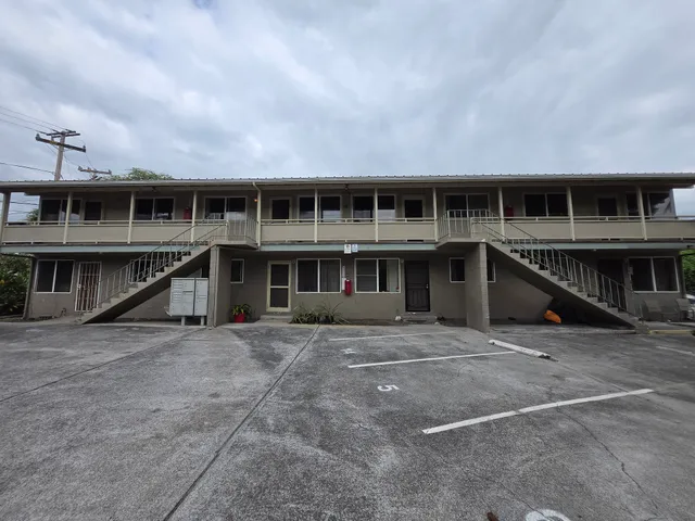 a view of house with deck and kitchen view